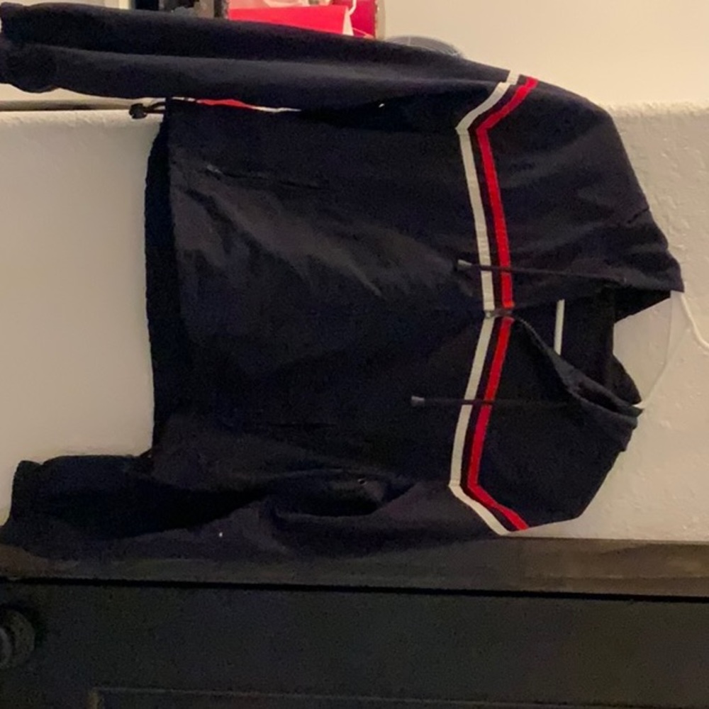 Navy blue windbreaker jacket w/ red & white trim, zipper, pockets, & hood. S